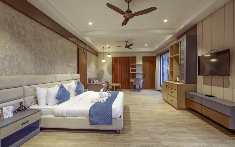 Supreme Room — king bed, lounge sofa and TV unit